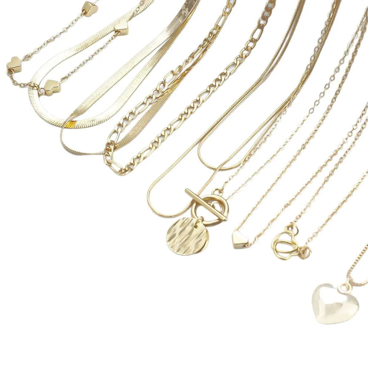 Set of ten simple gold women's necklaces with alloy pendants on snake bone chains.