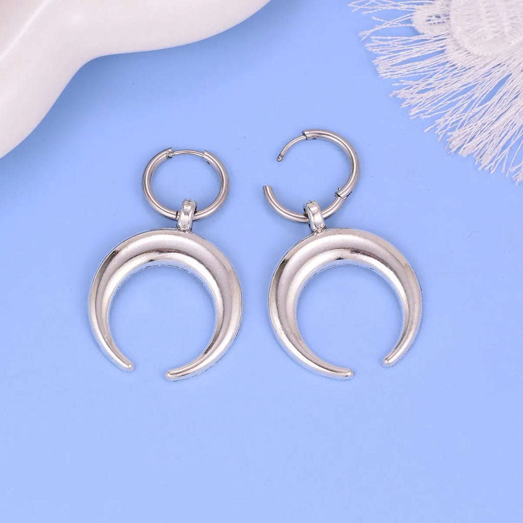 Silver geometric hoop earrings with gothic moon design and ear clip fastening