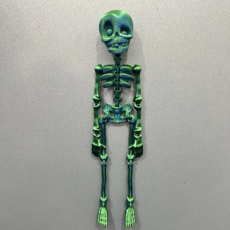3D printed white skull refrigerator magnet on a metal surface, showing its 18cm height.