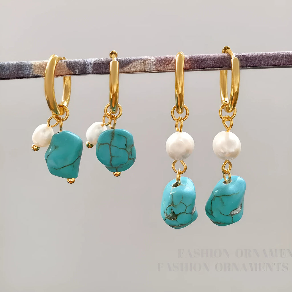 A pair of geometric copper clip-on earrings featuring irregular blue-green turquoise stones and white cultured pearls.