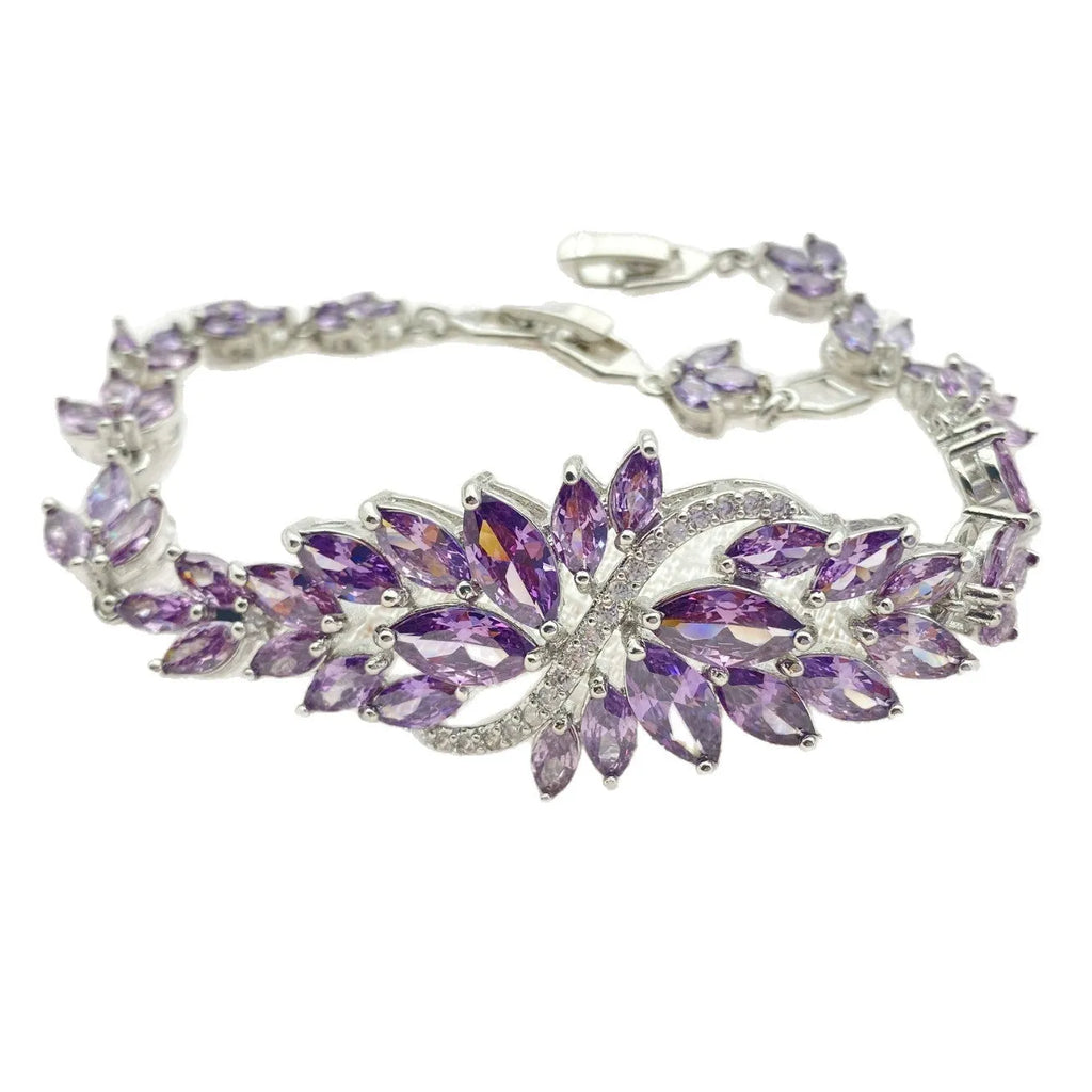 Gold electroplated copper bracelet with coloured zircon stones and ice flower design