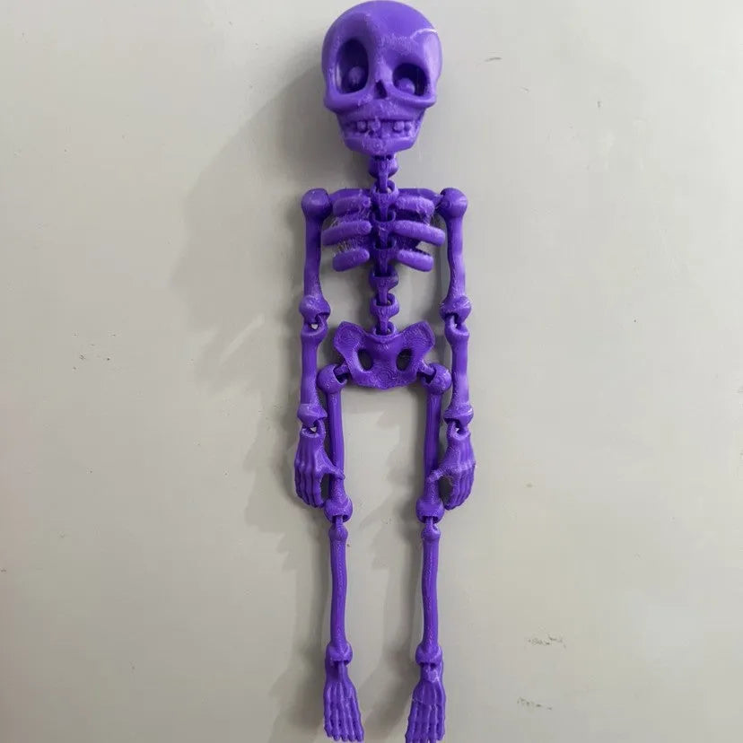 A detailed 3D printed white skull refrigerator magnet, 18cm tall, against a dark background.