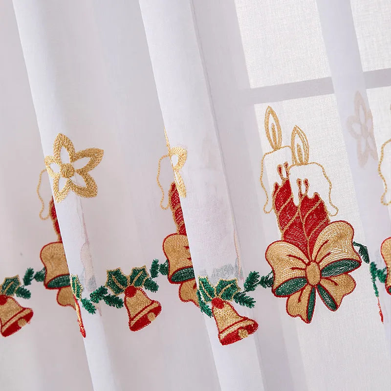 Pair of red and white American Christmas curtains with embroidered snowflake design hung on a window.