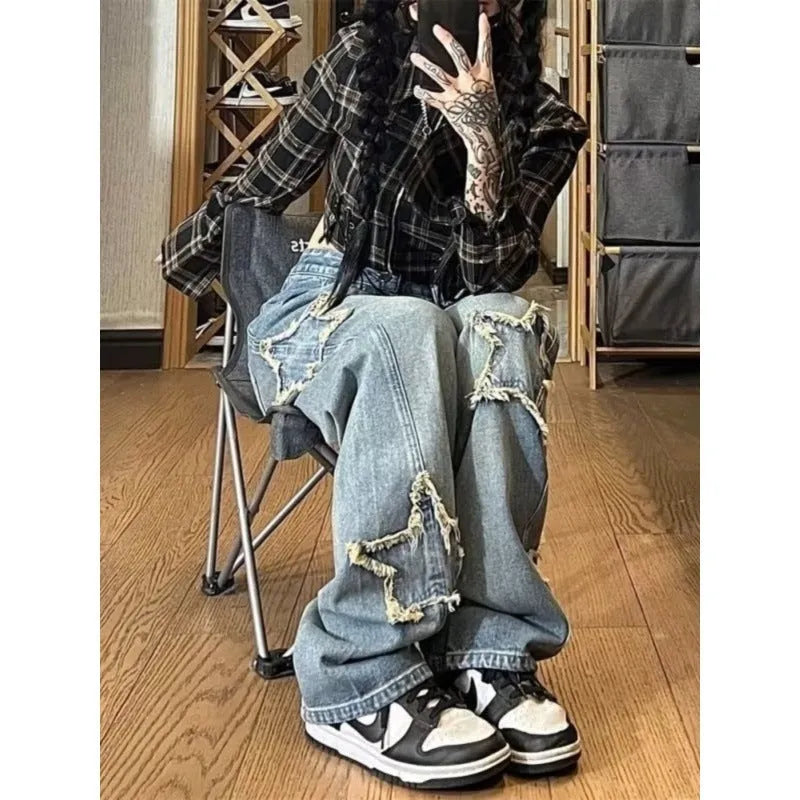 Blue women's straight-leg jeans with a high waist on a neutral background.