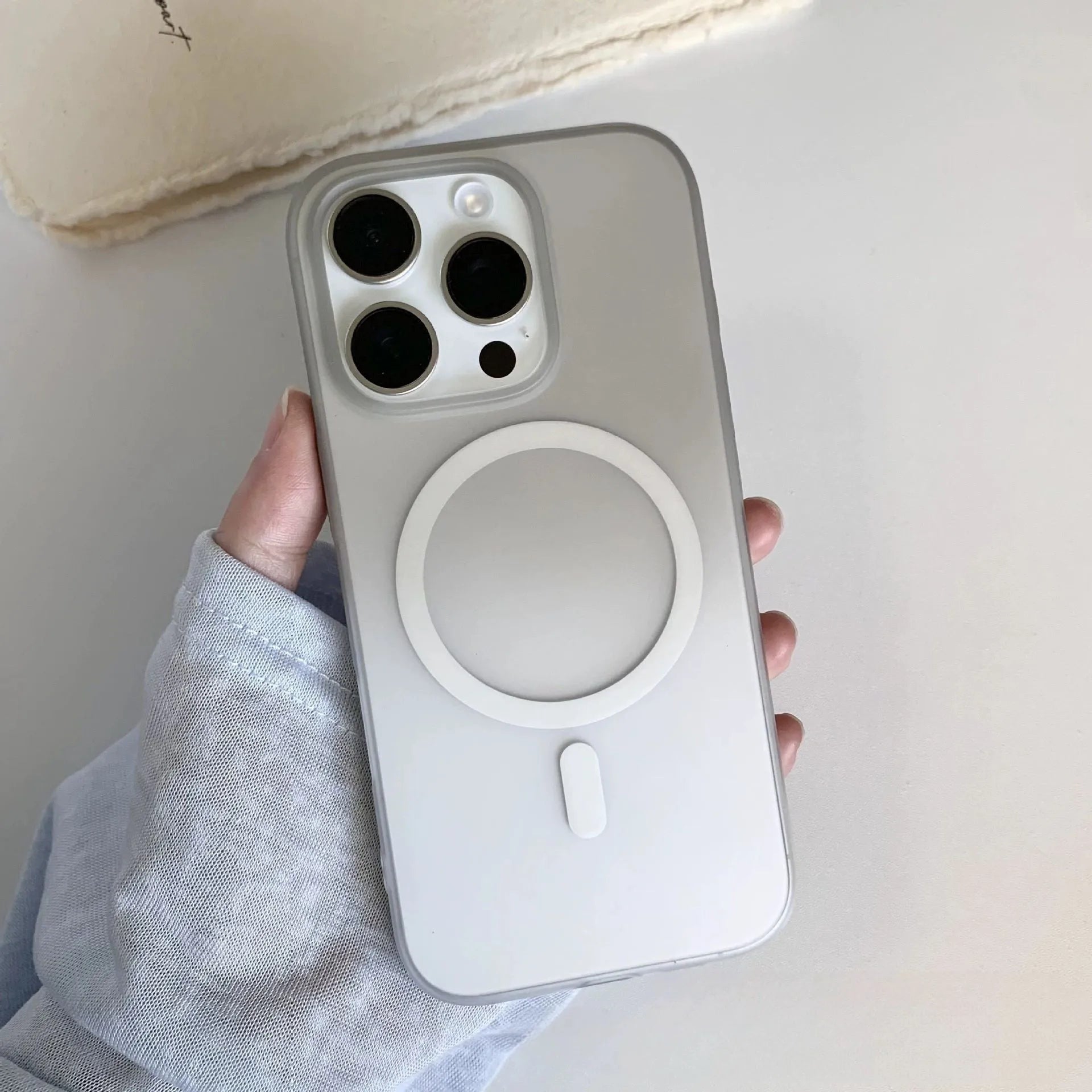Gradient coloured frosted magnetic suction case for iPhone on a table