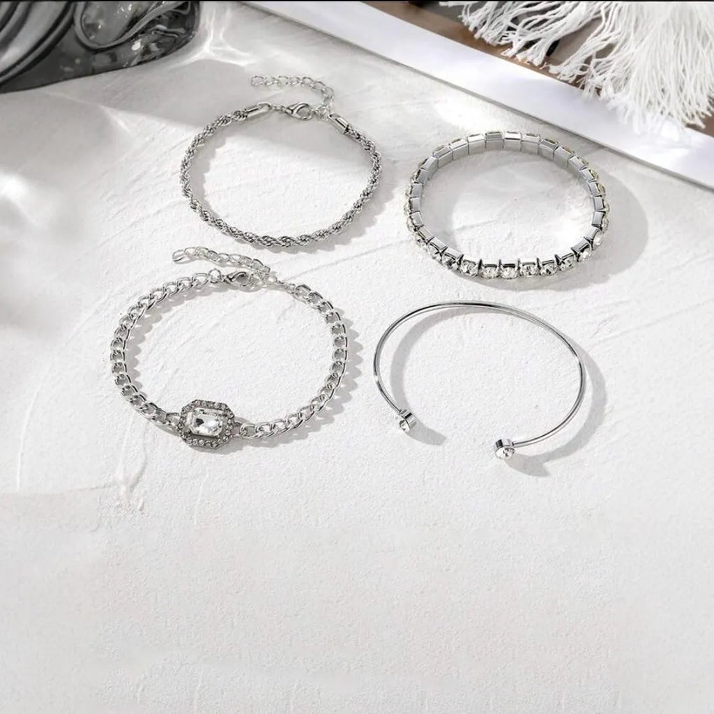 Retro geometric alloy bracelet four-piece set with square diamond details in gold and silver colours.
