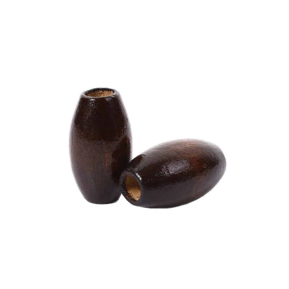 Oval M-shaped wooden bead in dark coffee colour, 25mm diameter with raised texture.