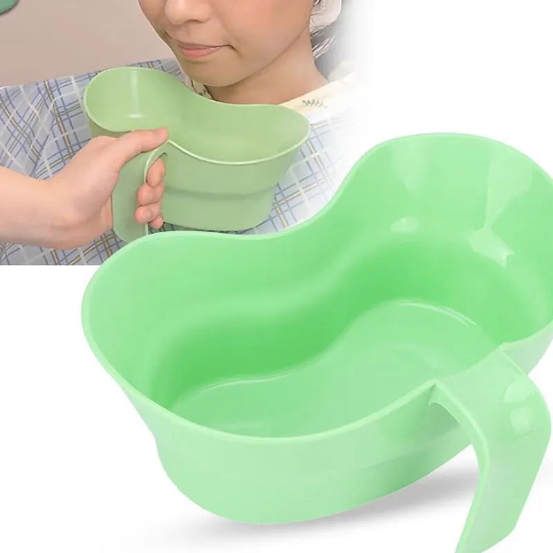 Green plastic gargle cup for bedridden elderly oral care.