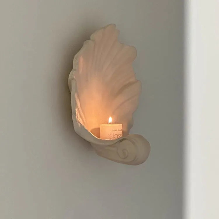 White resin fruit plate ornament with simulated shell storage design on wooden table