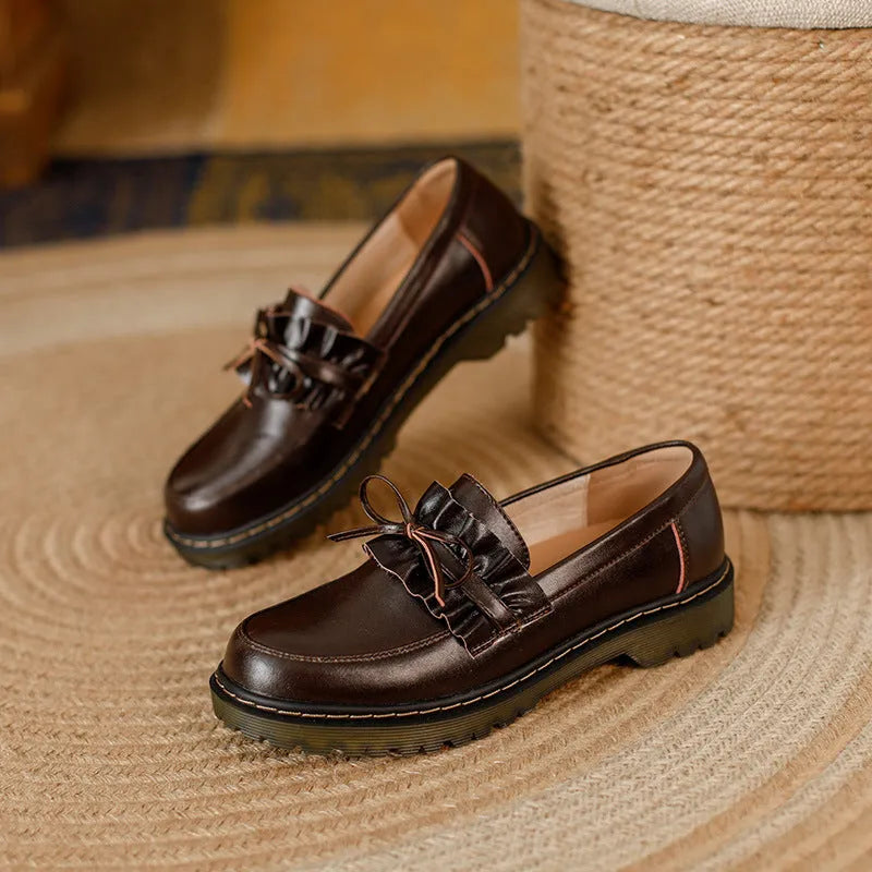 Women's black leather shoes with round toe and chunky flat heel, British style low-top design.