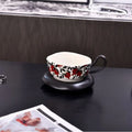 Antique style ceramic coffee cup and saucer set in black or orange colour, 210ml capacity.