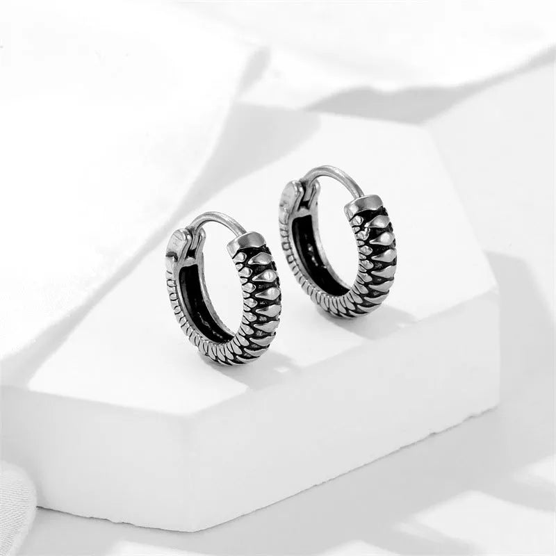 Silver retro twist geometric earrings with stripes pattern, made from titanium steel alloy.