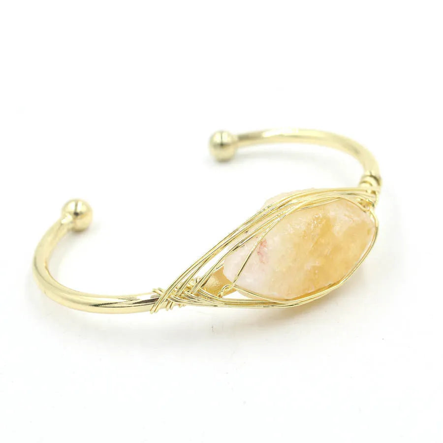 Natural raw gemstone bracelet with 8mm amorphous crystal beads on a white background.