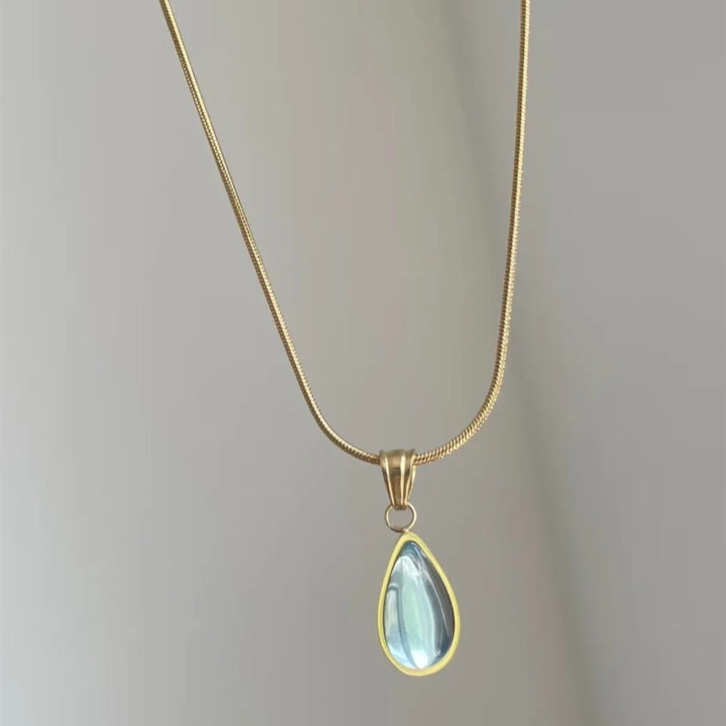 Retro blue and green water drop necklace with mixed gem inlay on a titanium steel snake bones chain.