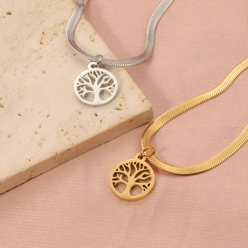 Gold or steel colour stainless steel necklace with a tree pendant on a snake bone chain.