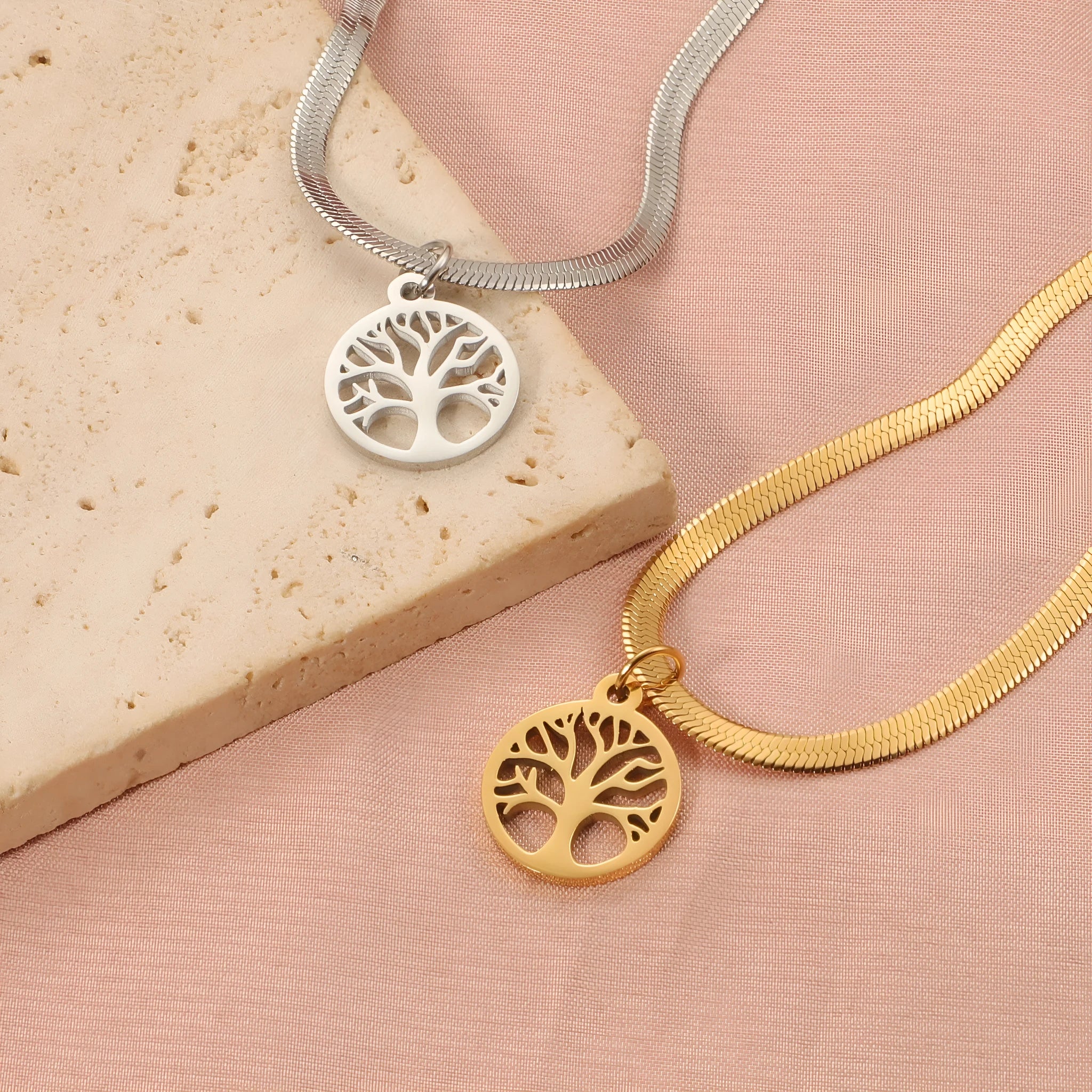 Gold or steel colour stainless steel necklace with a tree pendant on a snake bone chain.