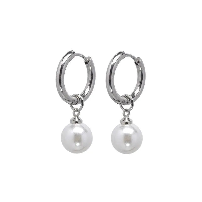 A pair of geometric-style pearl earrings for women with titanium steel posts.
