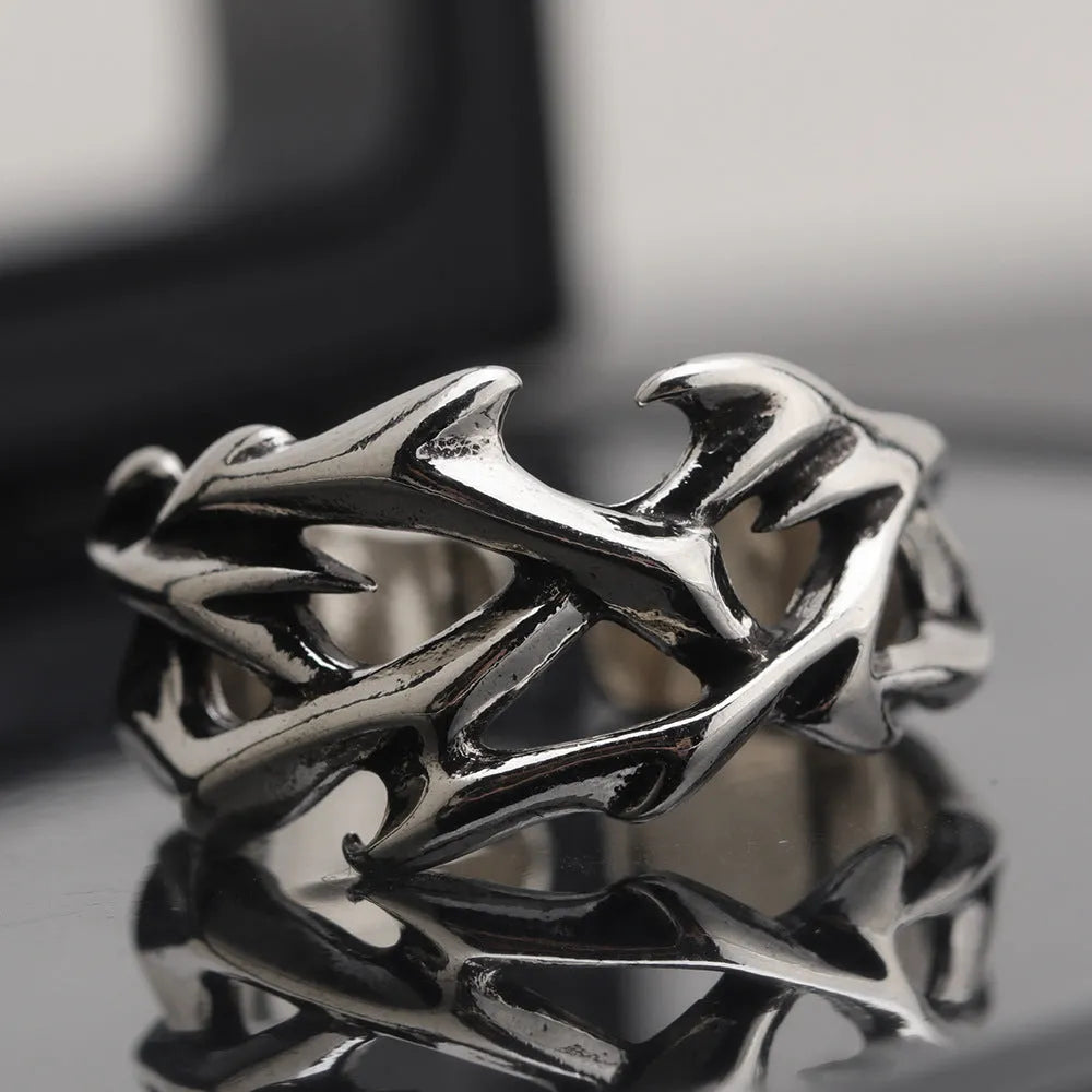 Copper men's ring with thorn flower design and adjustable geometric opening.