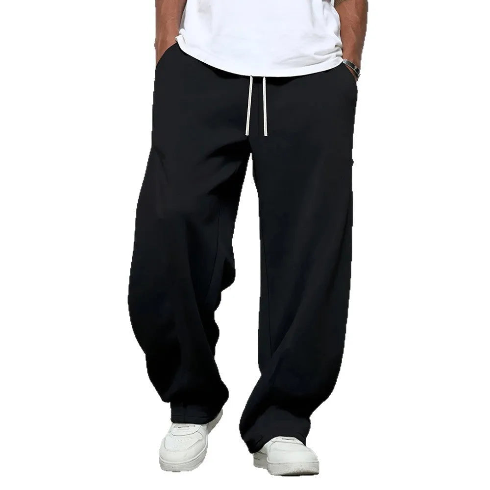 Men's straight-leg casual trousers in dark grey with a drawstring waistband.