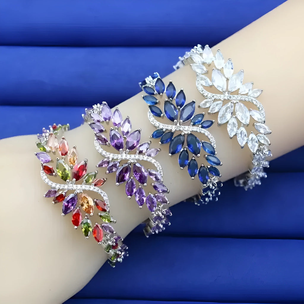 Gold electroplated copper bracelet with coloured zircon stones and ice flower design
