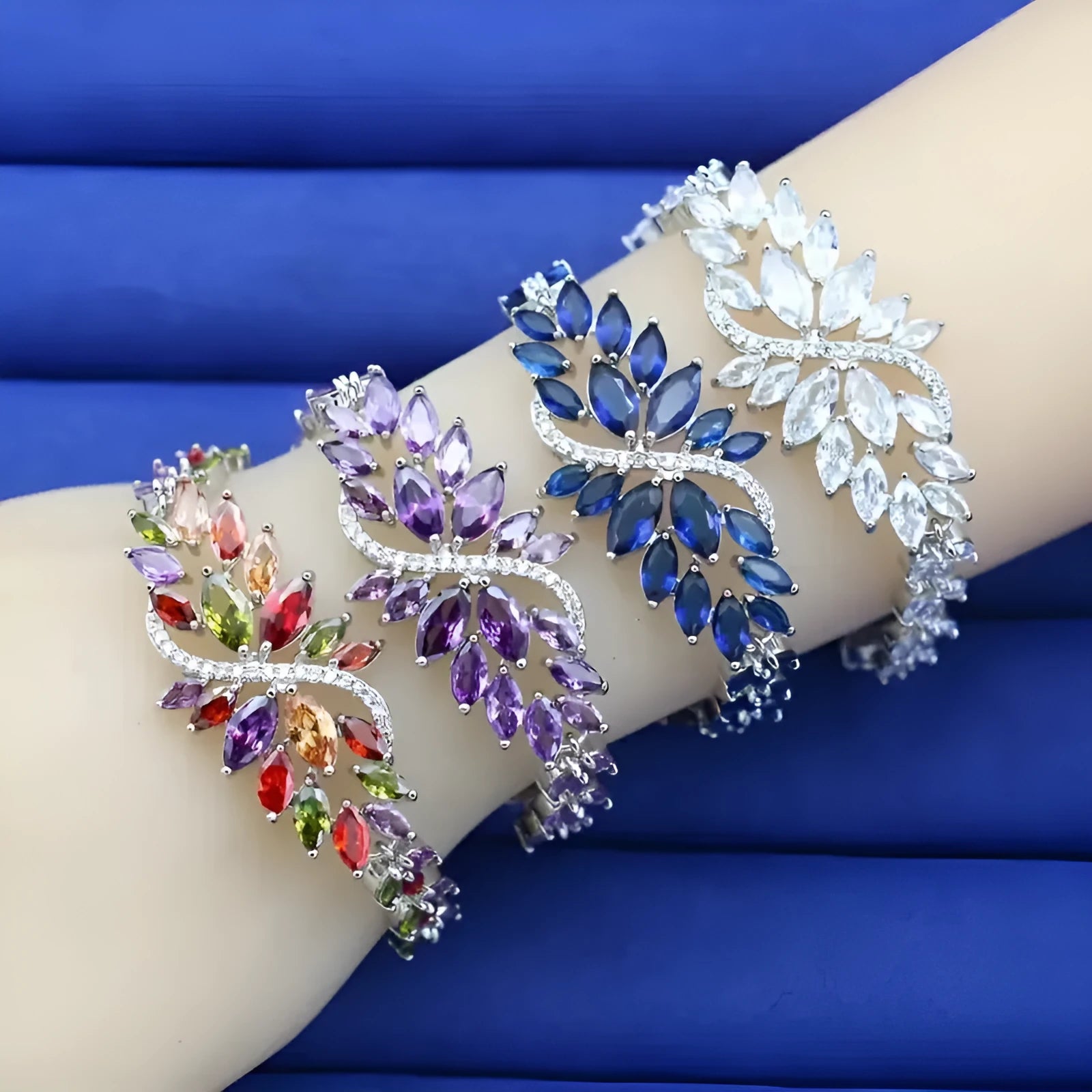 Gold electroplated copper bracelet with coloured zircon stones and ice flower design