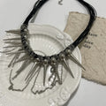 Leather necklace with winding tassel, round beads, and point rivet detailing for women