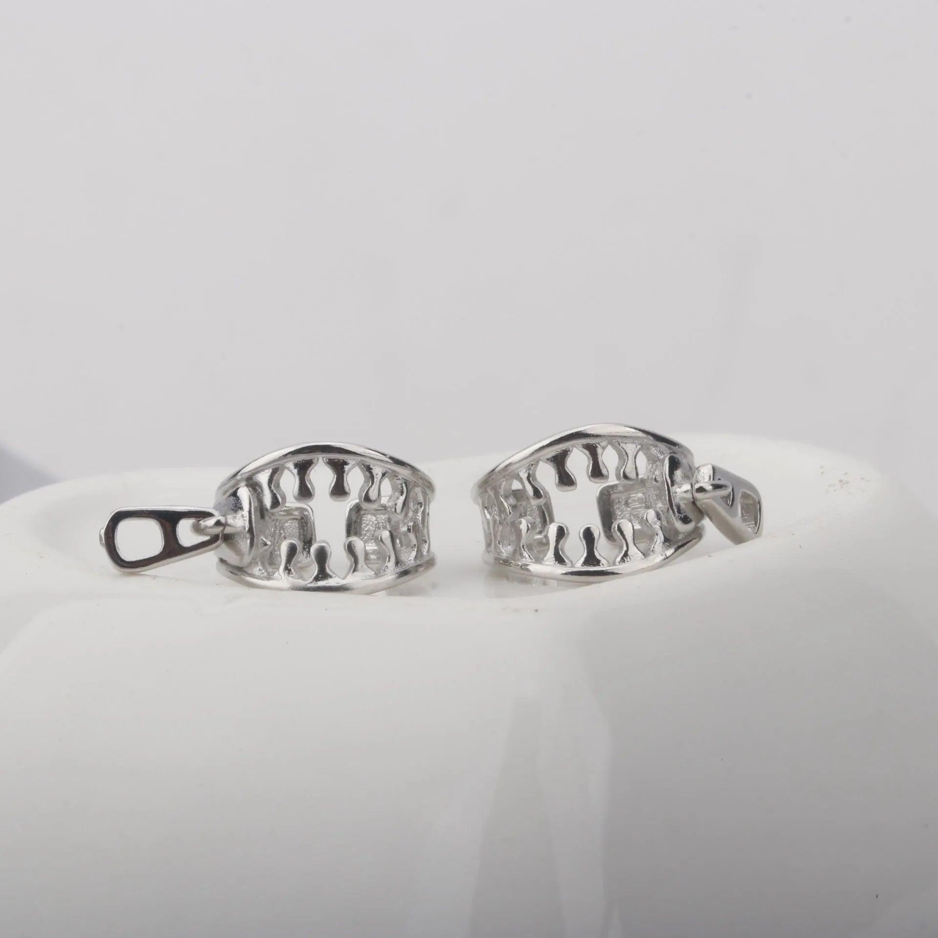 Geometric copper ear bone clip earrings with zipper clip design and line pattern details in colour ES862
