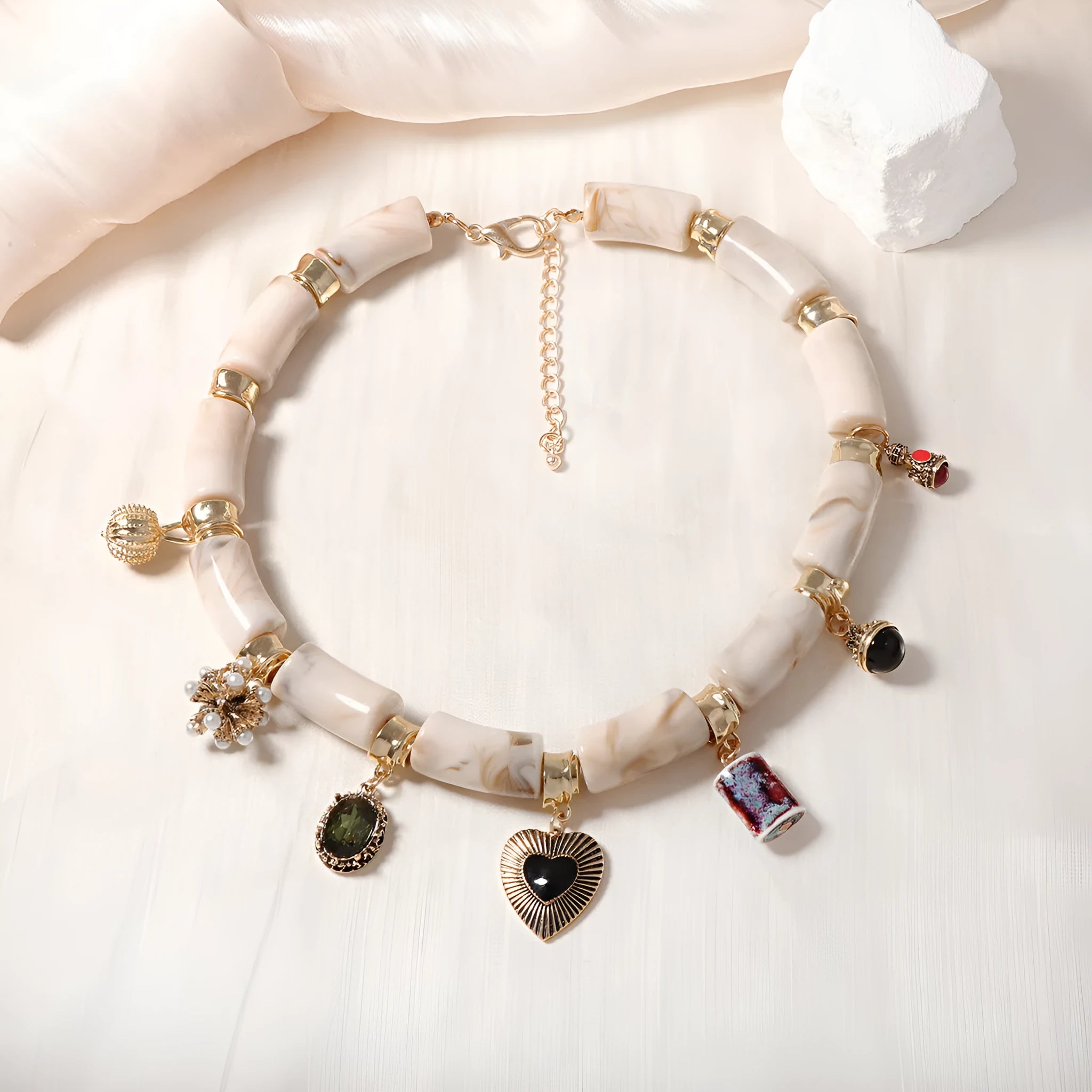 Gold-tone heart-shaped resin bamboo pendant necklace with electroplated chain