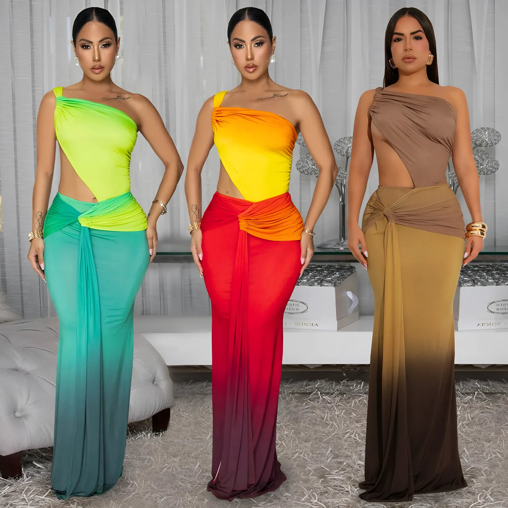 Long brown, green, and red gradient colour dress with a high waist, cross-shoulder neckline, and sleeveless design on a mannequin.