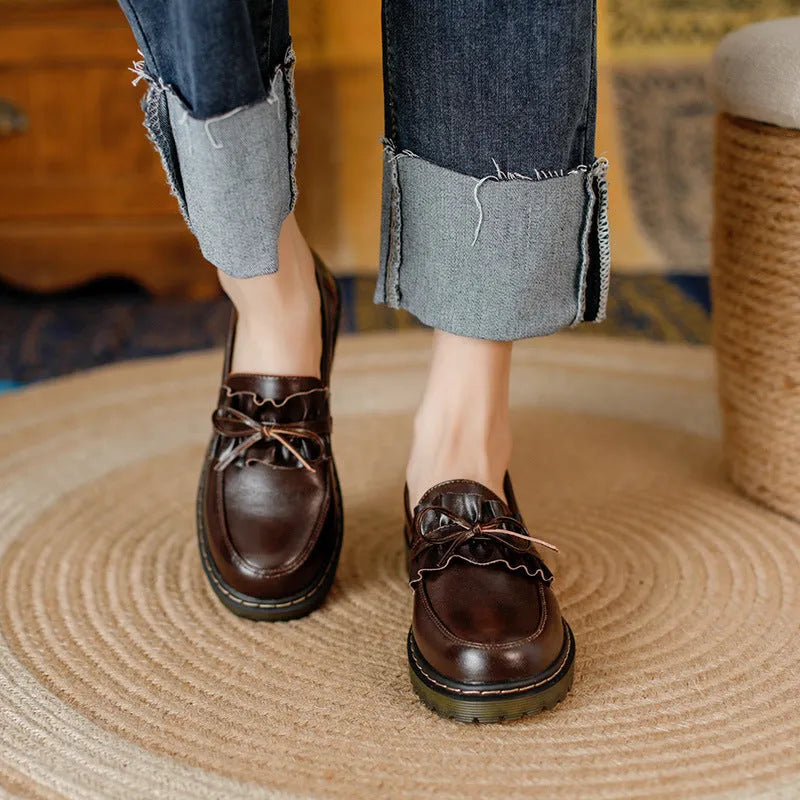 Women's black leather shoes with round toe and chunky flat heel, British style low-top design.