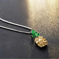 Silver plated women's necklace with a geometric pineapple pendant and diamond charm.