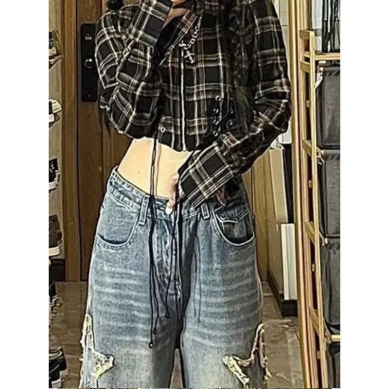 Blue women's straight-leg jeans with a high waist on a neutral background.