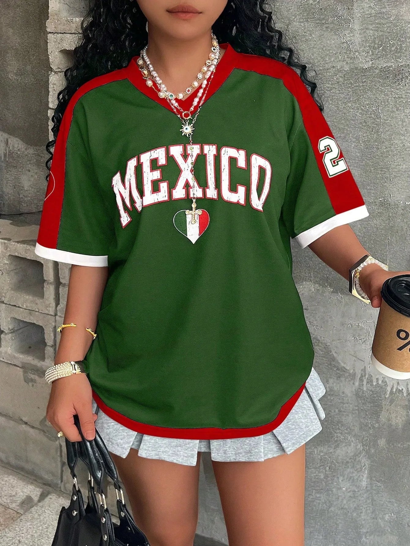 Women's loose-fit V-neck short-sleeved T-shirt featuring a 3D raised letter print on the front.