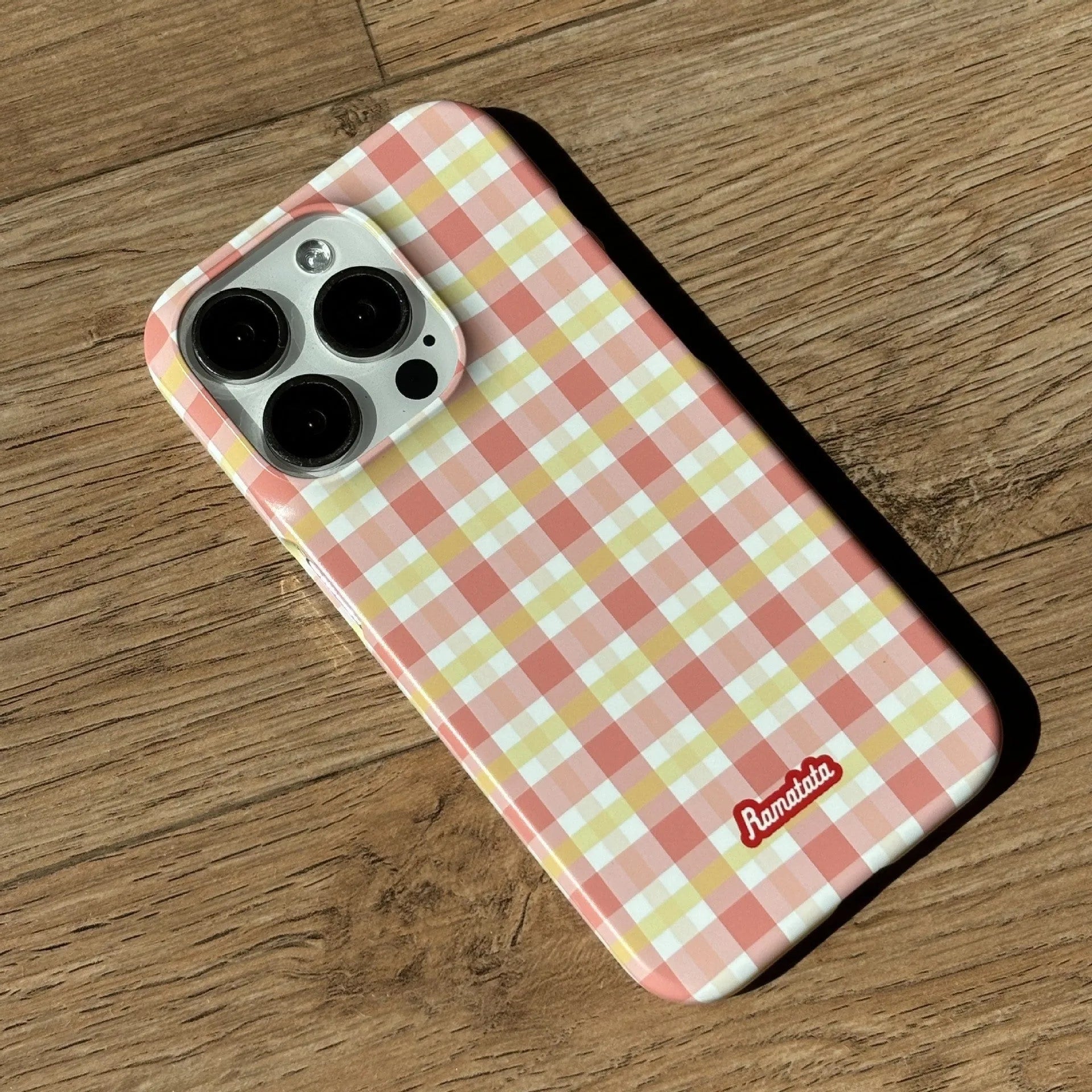 Original plain plaid design iPhone 15 Pro Max case in glossy red grid or frosted orange grid options.