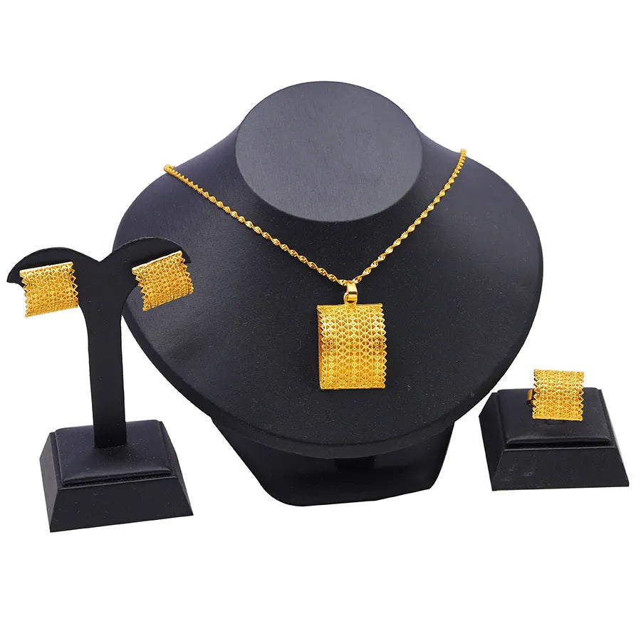 Golden copper bridal jewellery set showing matching necklace, earrings and ring for wedding occasions