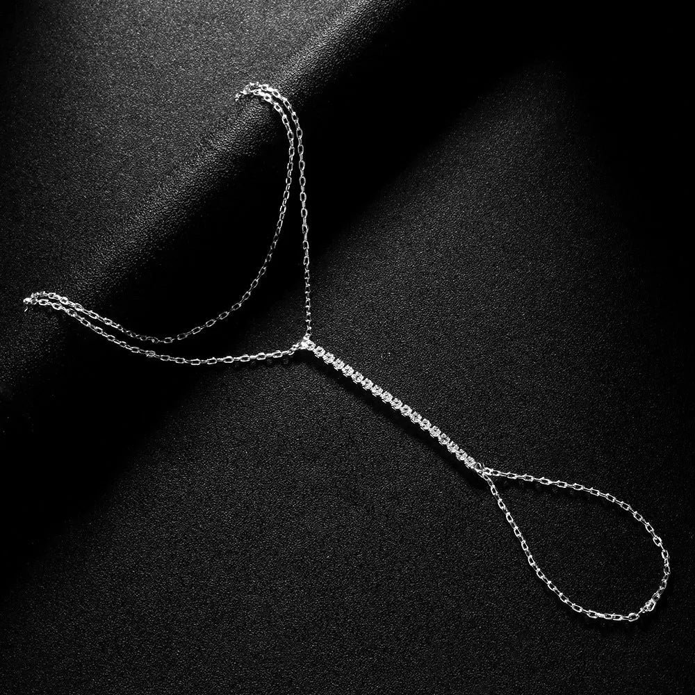 Women's geometric-shaped rhinestone bracelet in silver or gold colour on a wrist.