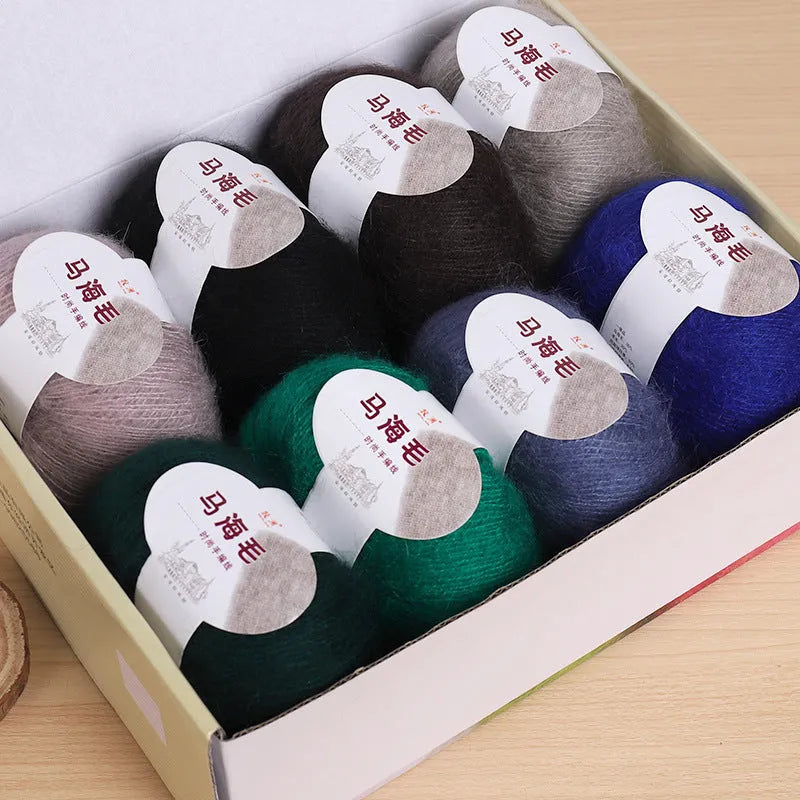 Single 100g ball of mohair yarn for a DIY hand-woven scarf kit, showing the fluffy texture.