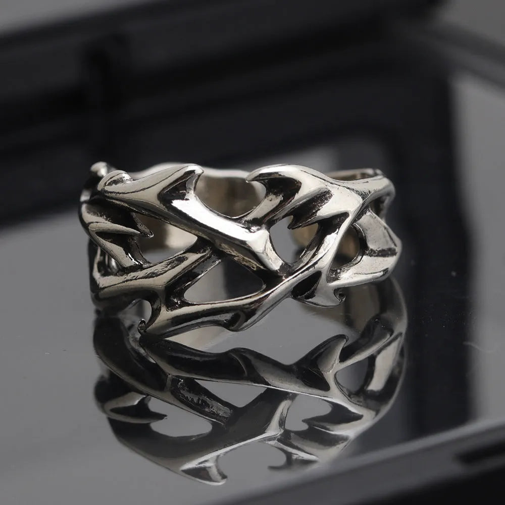 Copper men's ring with thorn flower design and adjustable geometric opening.