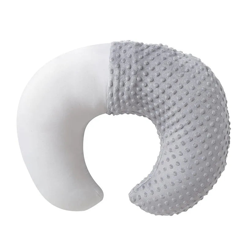 Gray U-shaped nursing pillow with removable cover on a neutral background.