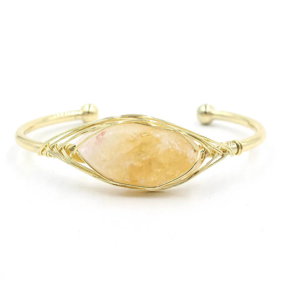 Natural raw gemstone bracelet with 8mm amorphous crystal beads on a white background.
