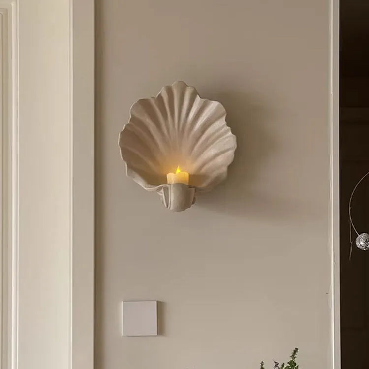 White resin fruit plate ornament with simulated shell storage design on wooden table