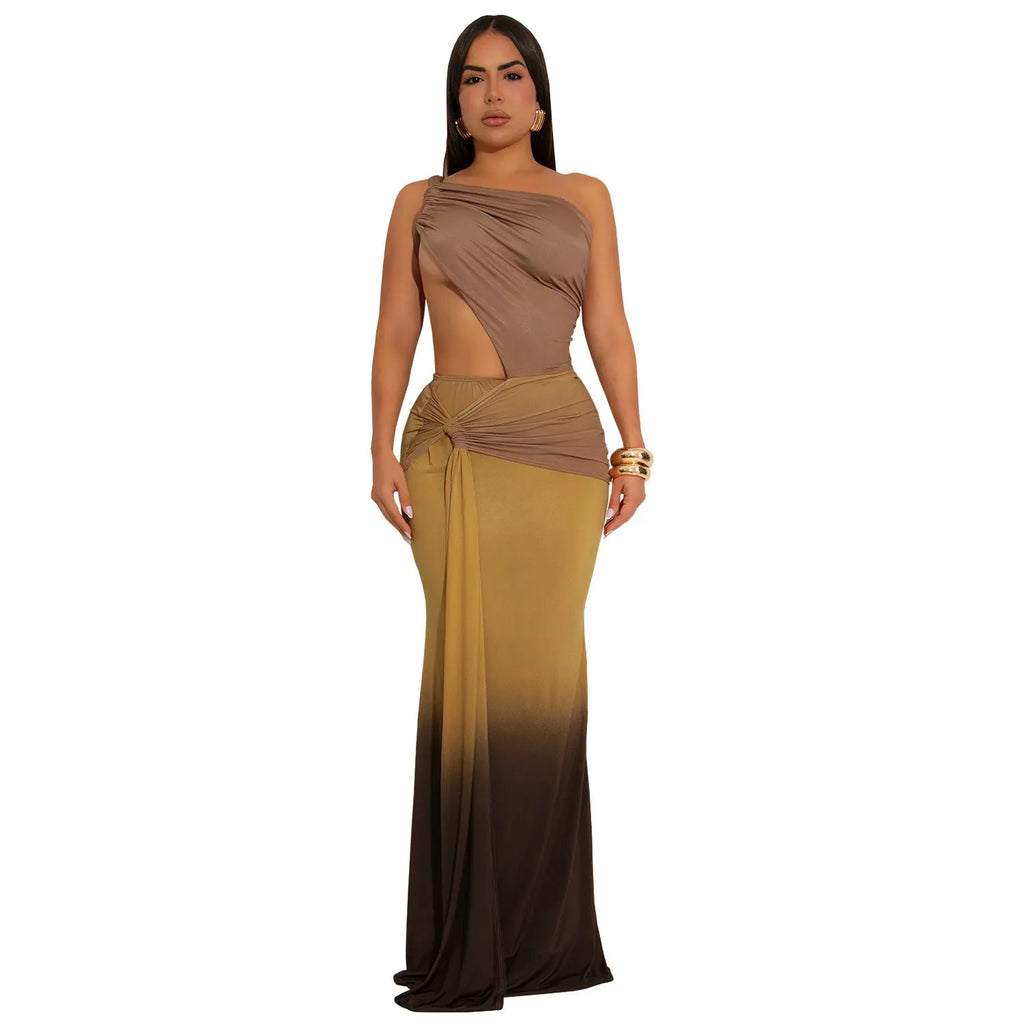 Long brown, green, and red gradient colour dress with a high waist, cross-shoulder neckline, and sleeveless design on a mannequin.