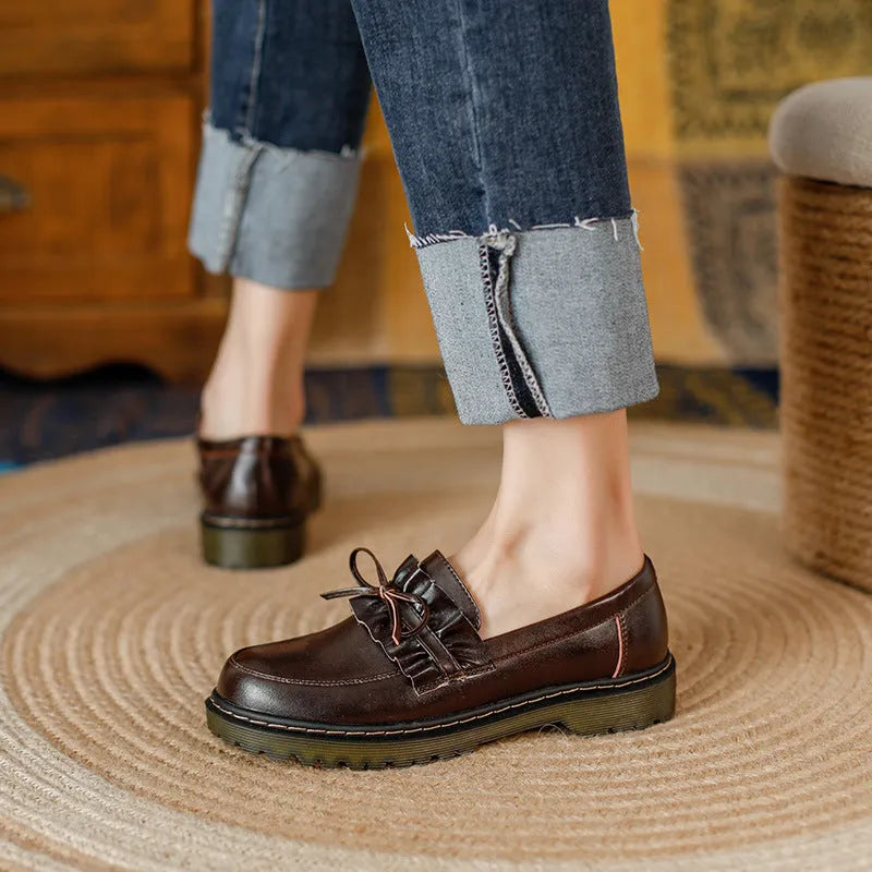 Women's black leather shoes with round toe and chunky flat heel, British style low-top design.