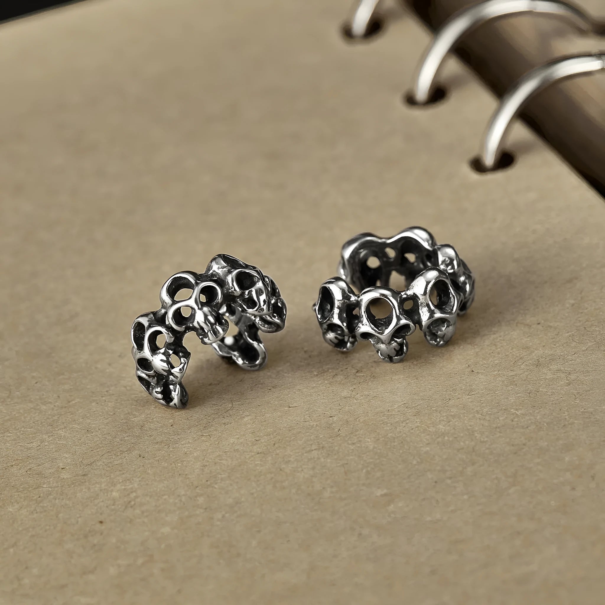 Retro skull design stainless steel ear clips with hollow geometry and electroplated finish