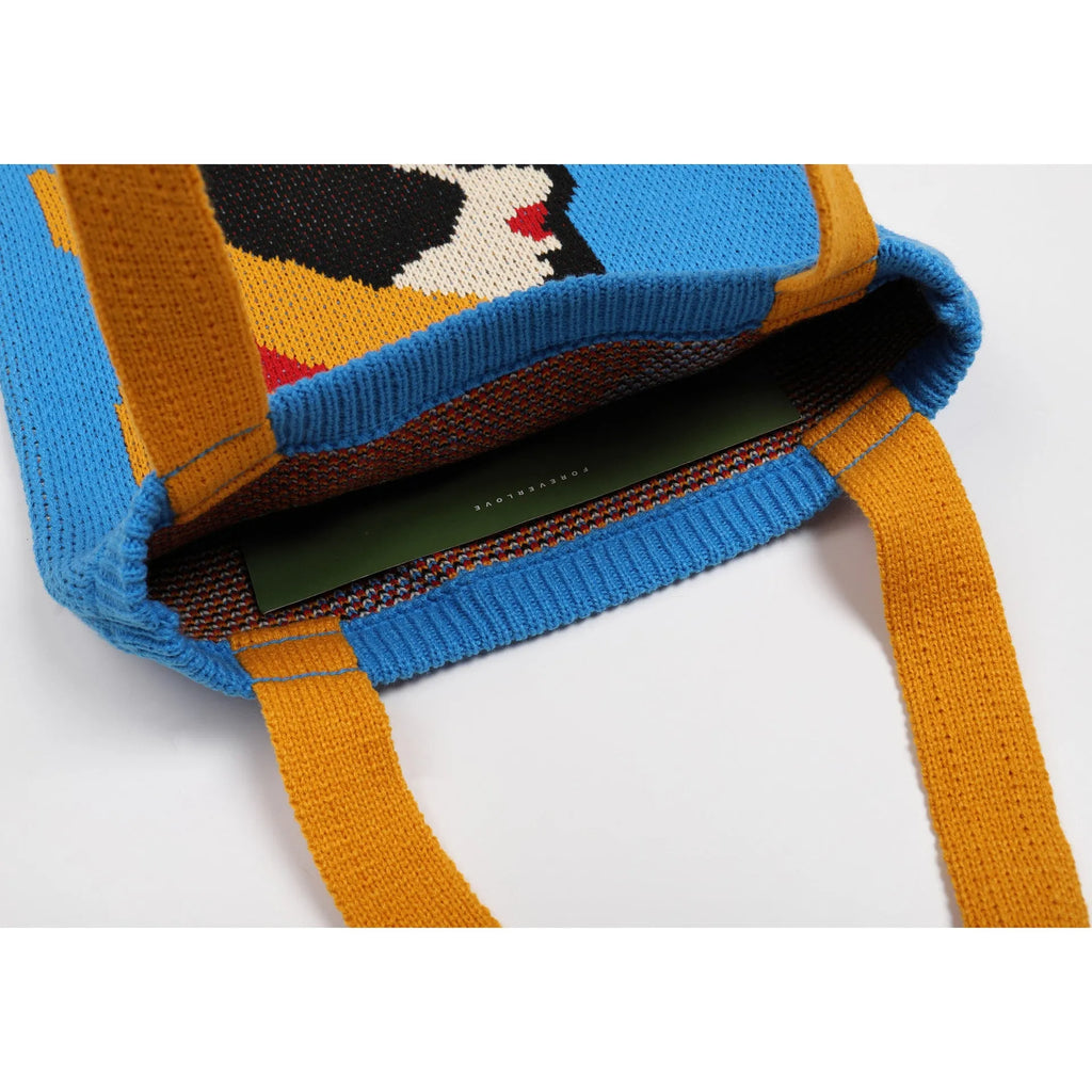 Blue urban simplicity woven handbag with box shape and soft handle on textile surface