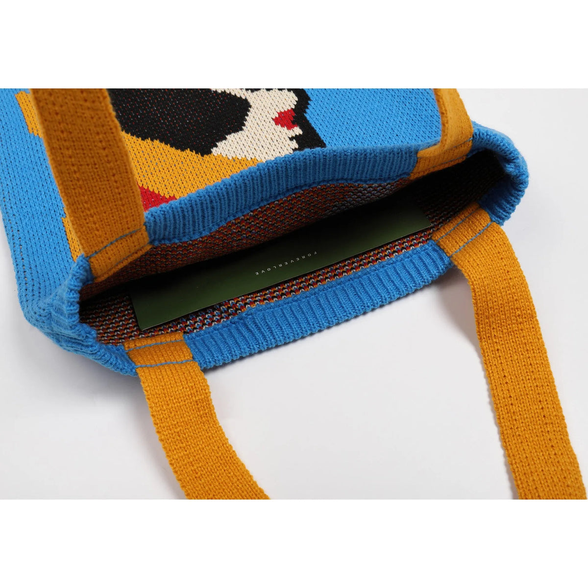 Blue urban simplicity woven handbag with box shape and soft handle on textile surface