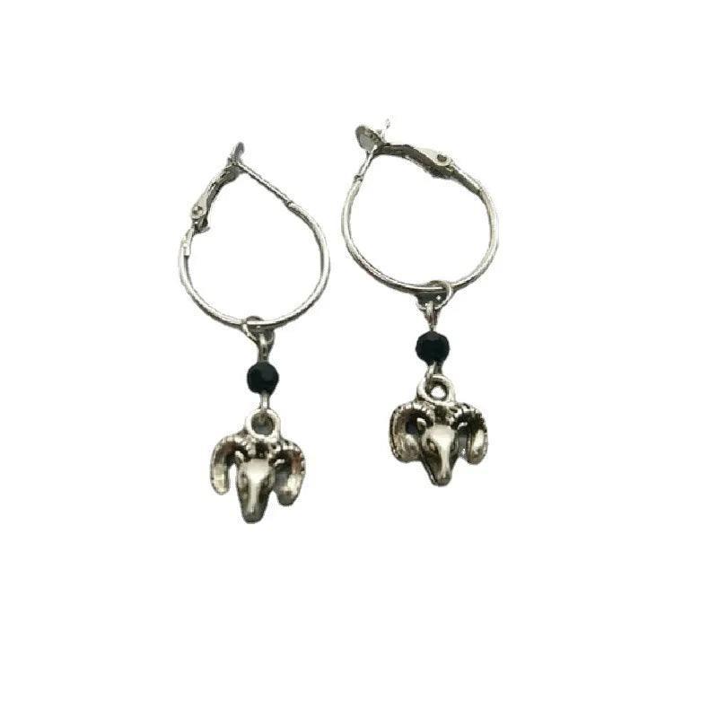 Silver round ring earrings with a Tibetan Antelope design motif.