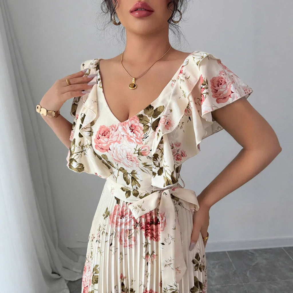 Apricot floral print V-neck dress with ruffle sleeves and a long swing skirt.