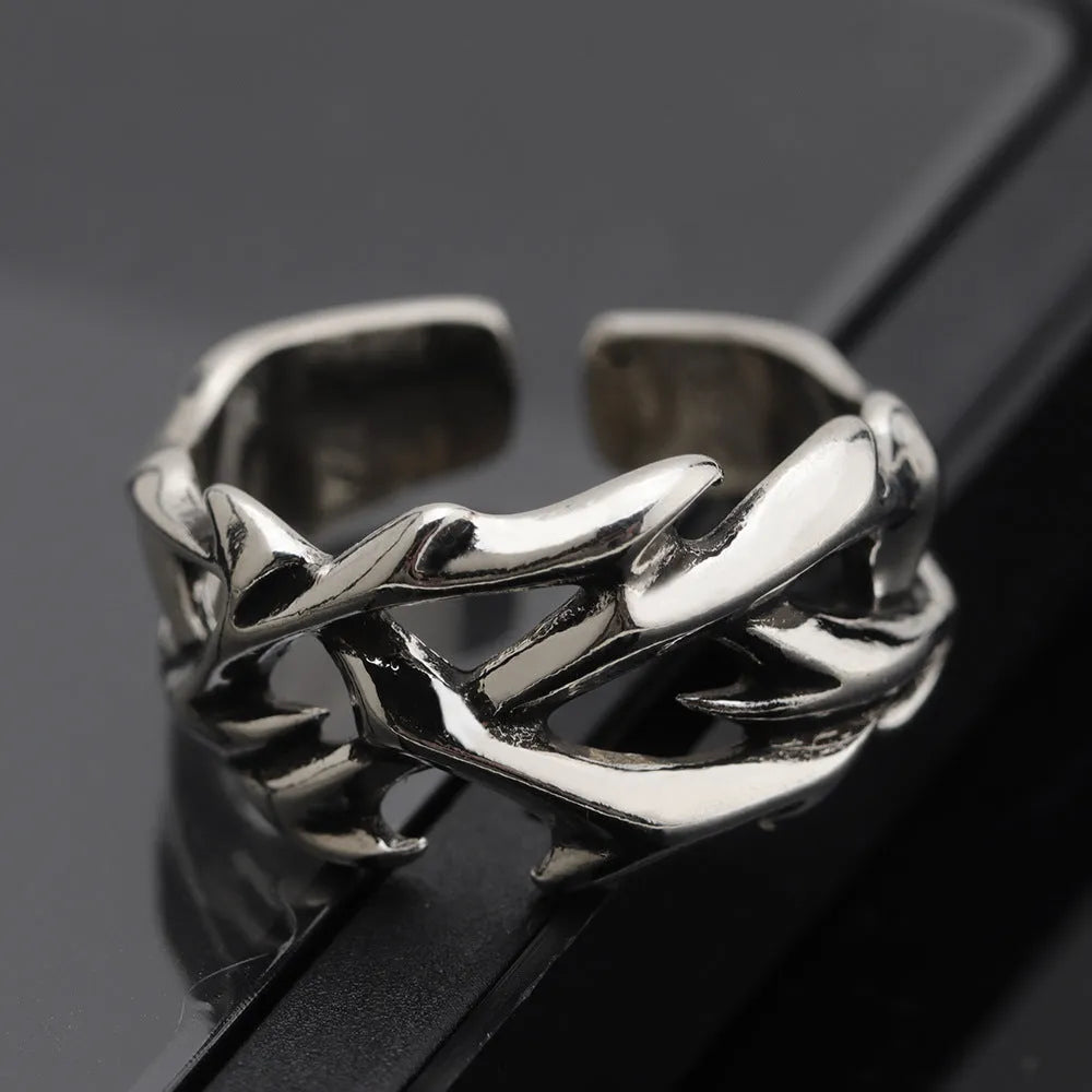 Copper men's ring with thorn flower design and adjustable geometric opening.