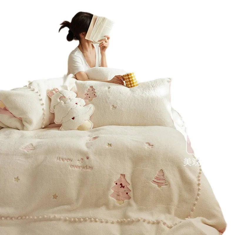 Milk fibre bedding four-piece set with green Christmas tree pattern on a bed.